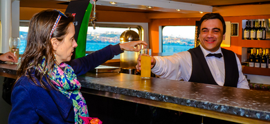 Get a fresh drink at the bar on board