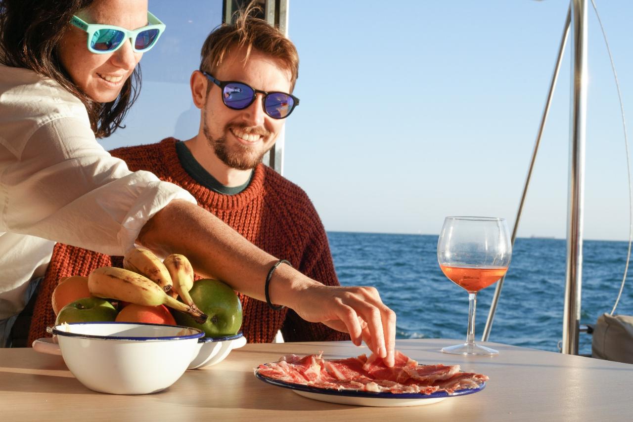 Enjoy the food on a catamaran in Barcelona