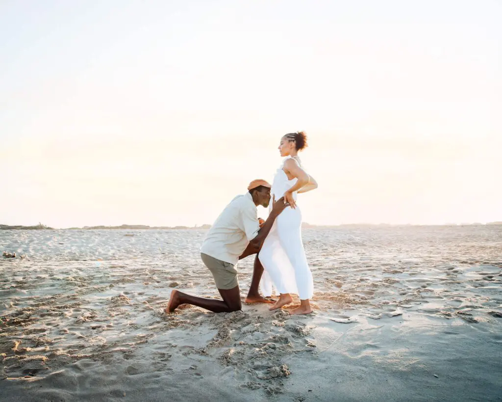 couple posing on a beach in ibiza