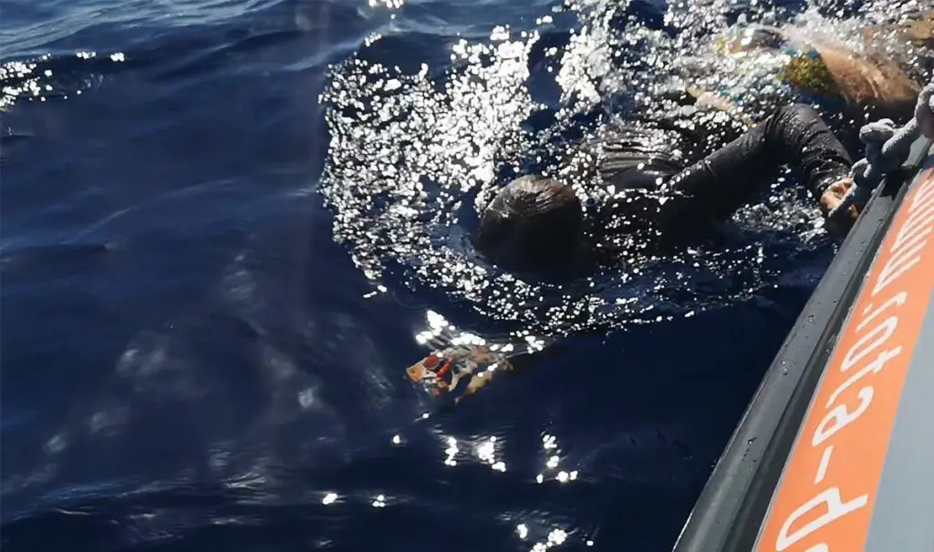 You'll be holding on to the boat with a rope