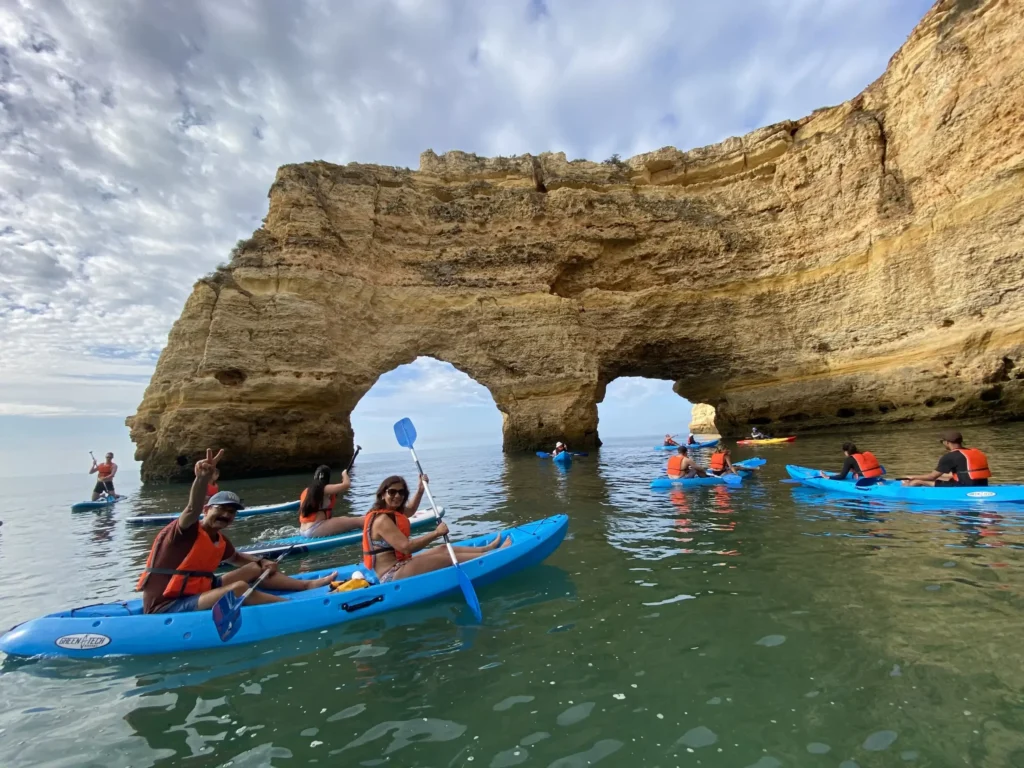 kayakers in front of the Marinha Arches in the Algarve