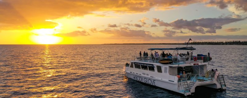 Big motor catamaran during sunset in Hawaii