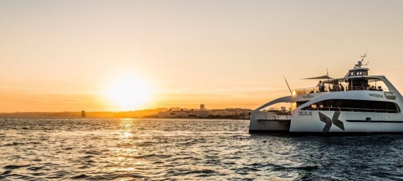 Catamaran during sunset in Lisbon