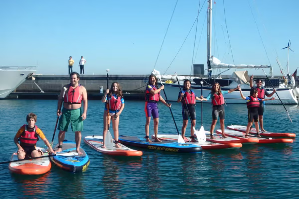 Group of friends on SUP boards in Oeiras, close to Lisbon