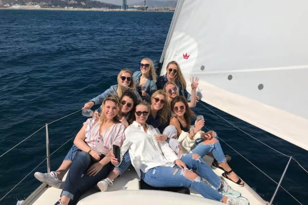 Friends on a sailing boat in Barcelona