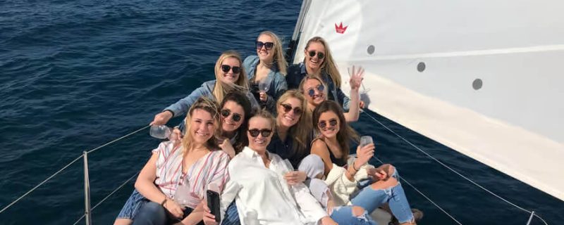 Friends on a sailing boat in Barcelona