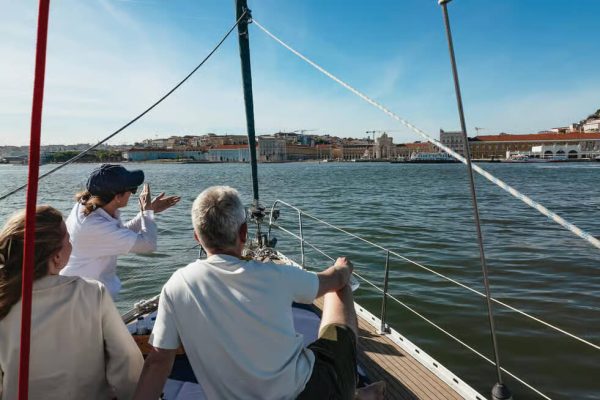 People on a boat sightseeing in Lisbon