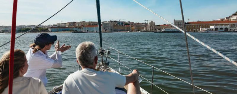 People on a boat sightseeing in Lisbon