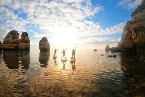 Three people on Stand up paddle boards in Lagos